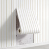 White vertical ribbed wall panels with a rolled-up panel displaying a textured gray surface.