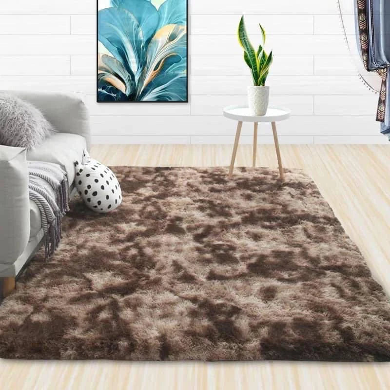 A luxurious brown velvet plush carpet placed on a light wooden floor in a modern living room setting.