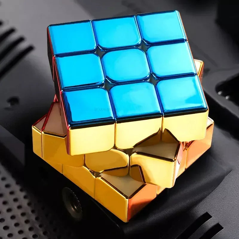 A 3x3 magnetic speed cube with a mirror finish, featuring blue and gold colored tiles.