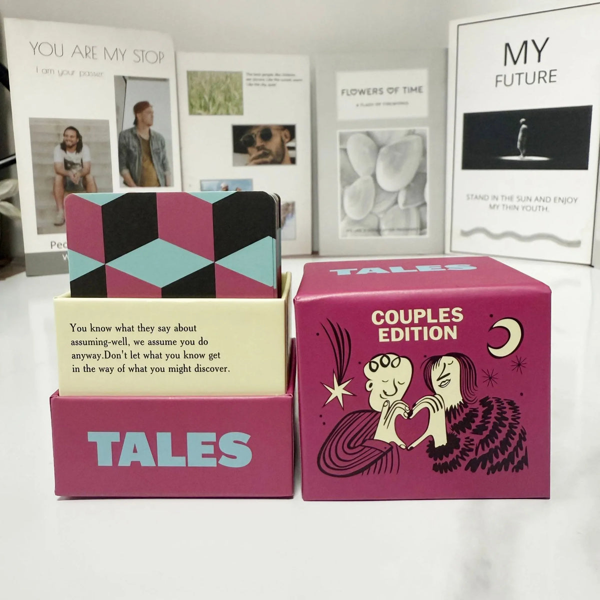 A collection of Tales conversation starter cards in various colored boxes and a framed poster titled My Future.