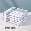 A stack of six black and white checkered lint-free dish cloths or kitchen towels.
