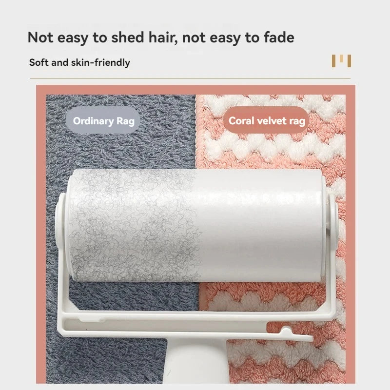 A roll of white microfiber cleaning rags displayed on a white rack against a background of gray and coral textured fabrics.