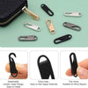A collection of various metal and plastic zipper pulls and sliders for replacement or repair.
