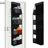 A black over-the-door hanging organizer with clear compartments displaying various stuffed animals and toys.