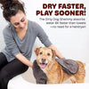 A woman is holding a fluffy dog towel while smiling, demonstrating the quick-drying property of the pet bath towel.