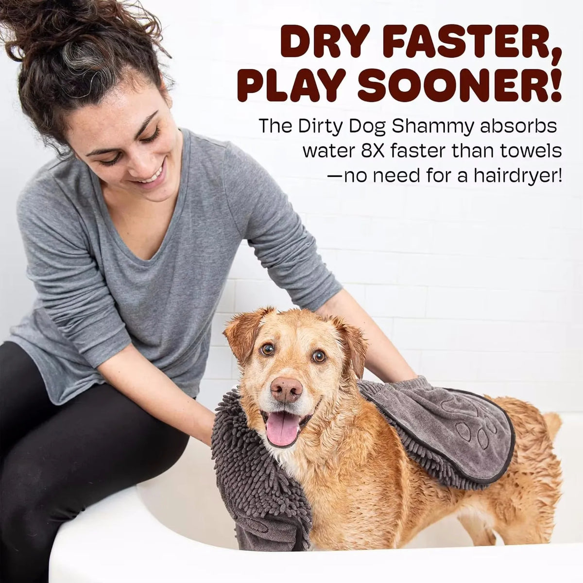 A woman is holding a fluffy dog towel while smiling, demonstrating the quick-drying property of the pet bath towel.