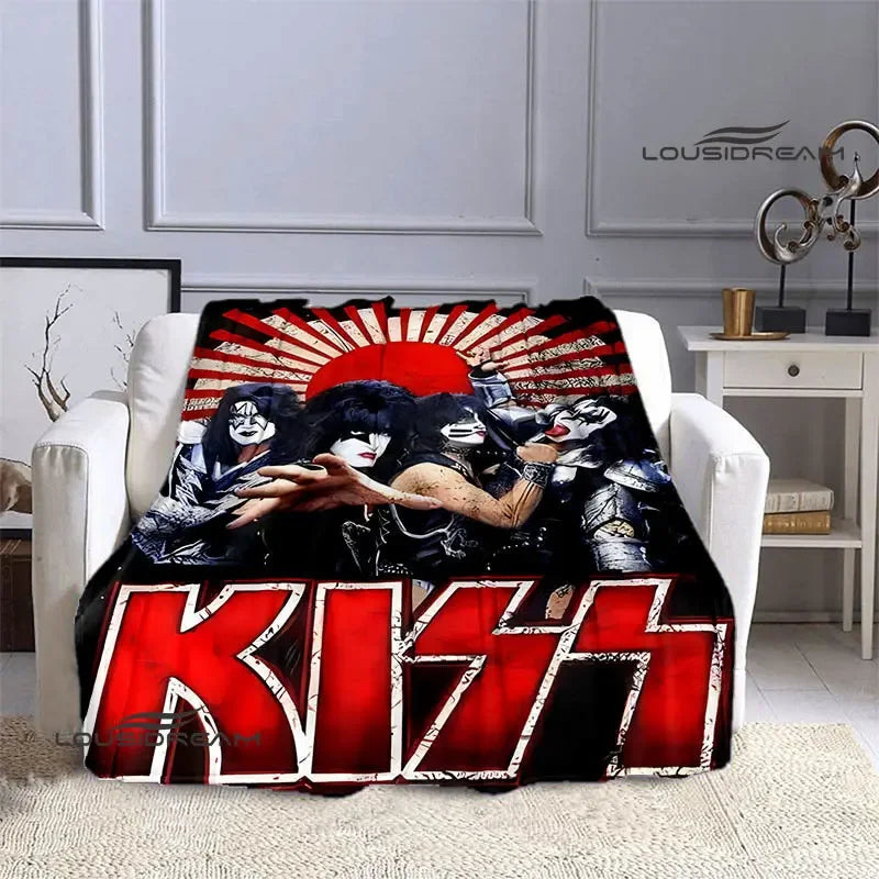 A black and red printed flannel throw blanket featuring the Kiss band logo and imagery.