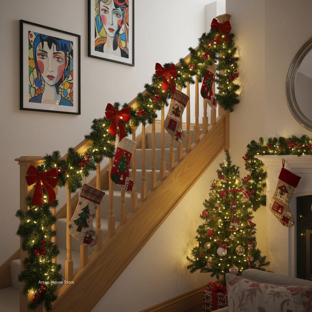 A wooden staircase decorated with an LED rattan Christmas garland and holiday accents.
