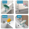 Various leaf-shaped suction cup soap dishes and draining trays used in kitchen, bathroom, shower, and sink areas.