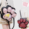 A black cat paw print backpack with multiple pink pockets and a large paw print design.