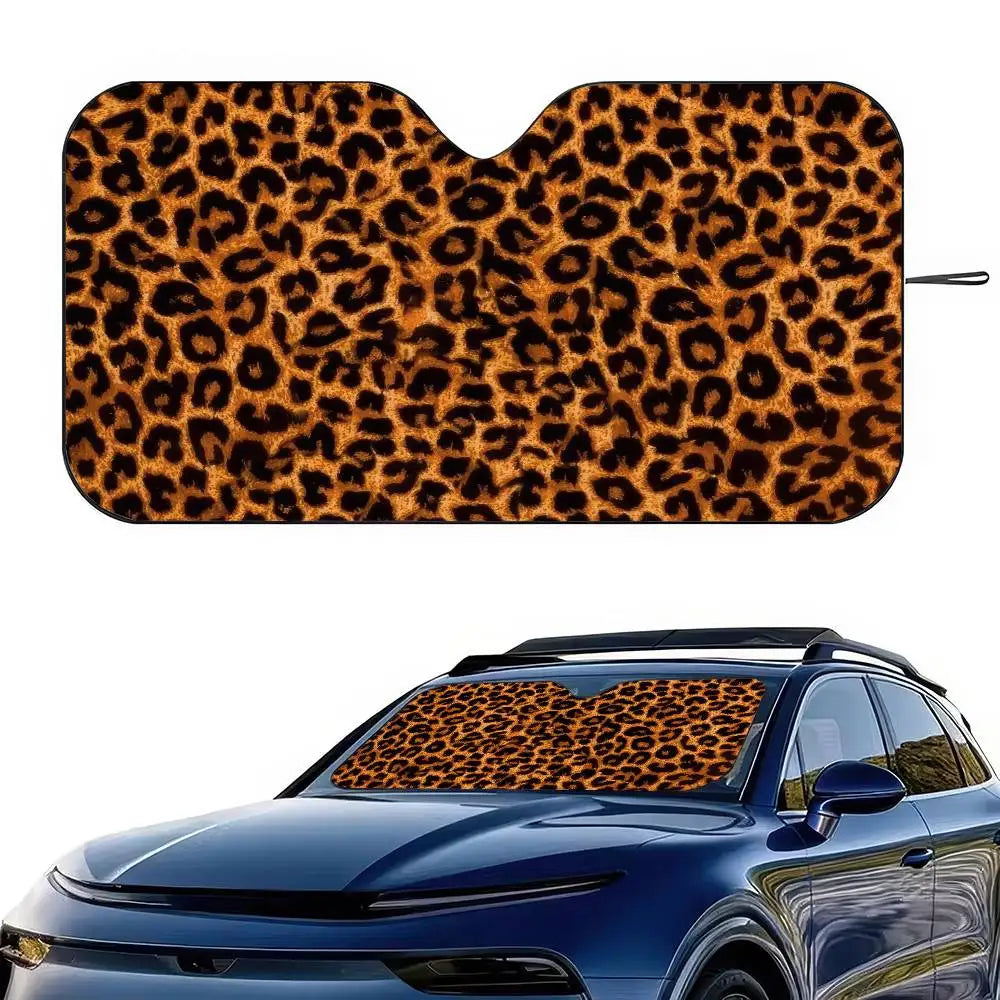 A leopard print car windshield sunshade applied to a blue car.