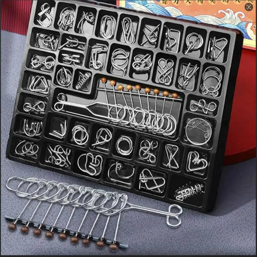 A black metal wire puzzle brain teaser set with various wire shapes and a separate wire tool.
