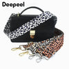 Black crossbody bag with a leopard print wide adjustable strap and gold hardware