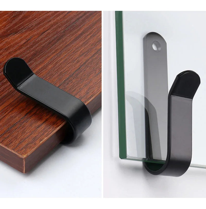 Black sturdy snowboard wall mount clips with screws shown against a white background.