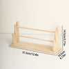 A light wood ladder jewelry organizer featuring multiple storage tiers and a wooden frame.