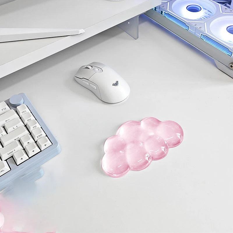A white ergonomic wrist rest set featuring a cloud-shaped pink silicone pad for a keyboard and mouse.