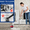 A woman is using a spin mop replacement scrub brush head on a floor with a long mop.