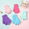 A collection of colorful plush winter gloves for kids in pink, purple, and light blue shades.
