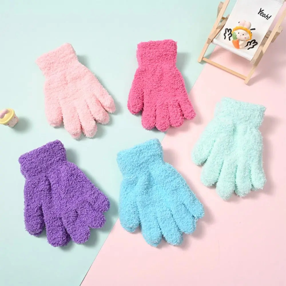 A collection of colorful plush winter gloves for kids in pink, purple, and light blue shades.