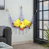 A yellow plush toy storage hammock with purple strings is hanging on a wall.