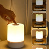 A hand is adjusting a Touch Dimmable LED table lamp, showing various brightness levels from 20% to 100%.