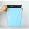 A hand is holding a light blue heavy-duty waterproof poly mailer bag with a black measuring tape on top.