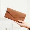 A brown slim RFID-blocking PU leather wallet shown in various views, including a folded form and being held by a hand.