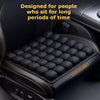 Black press-to-inflate seat cushion with a textured surface designed for long sitting periods.