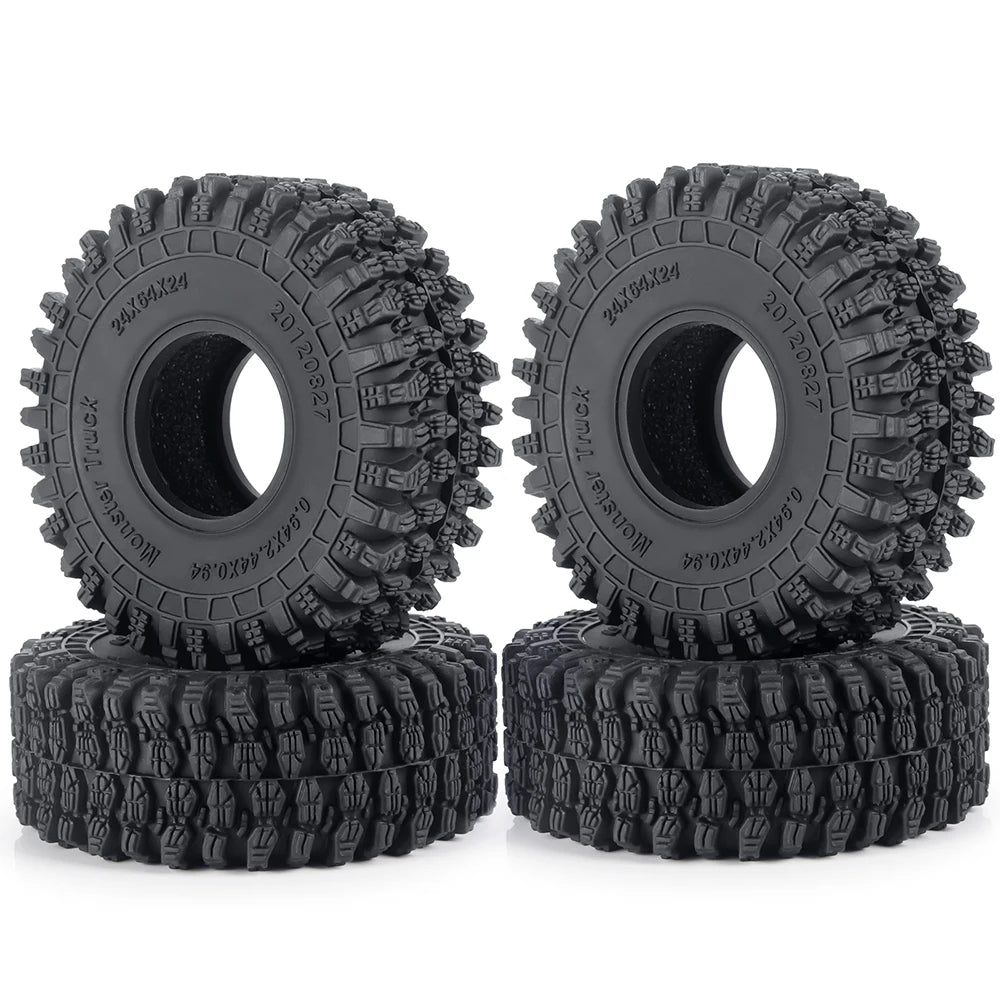 A pair of black rubber mud terrain tires for Axial SCX24 and TRX4M vehicles.