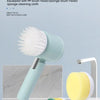 A cordless electric spin scrubber with a light blue handle and multiple interchangeable brush heads resting on a white surfac