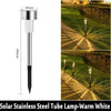 A vertical view of a solar stainless steel tube lamp used for garden path lighting.