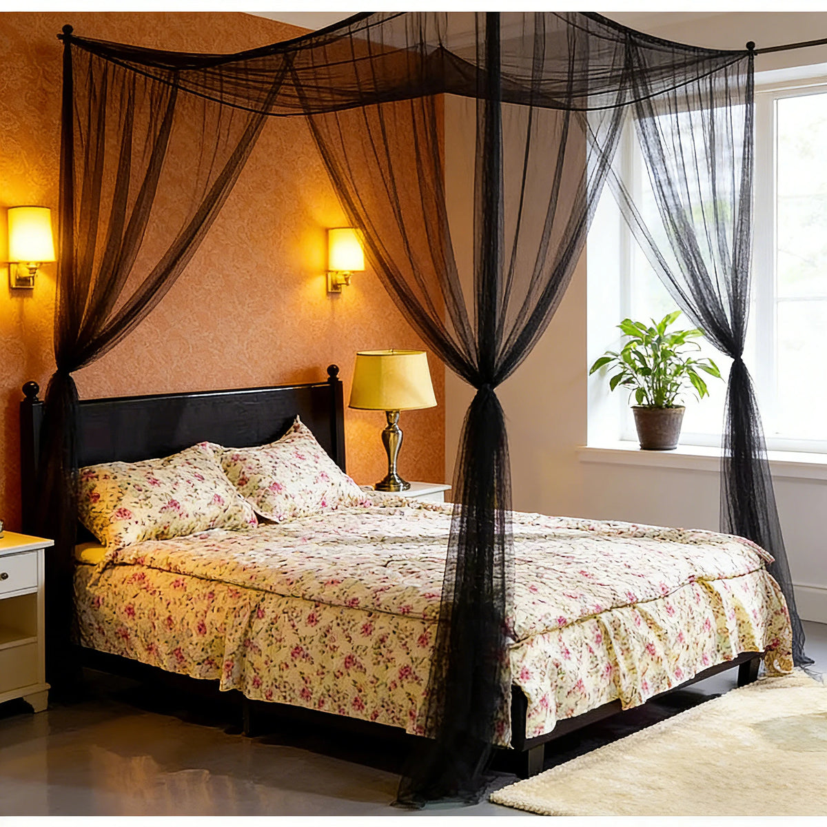 A bedroom featuring a dark wood bed draped with sheer black mosquito net canopy and warm wall sconces.