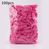 A package of 100 pink disposable transparent waterproof shower caps.