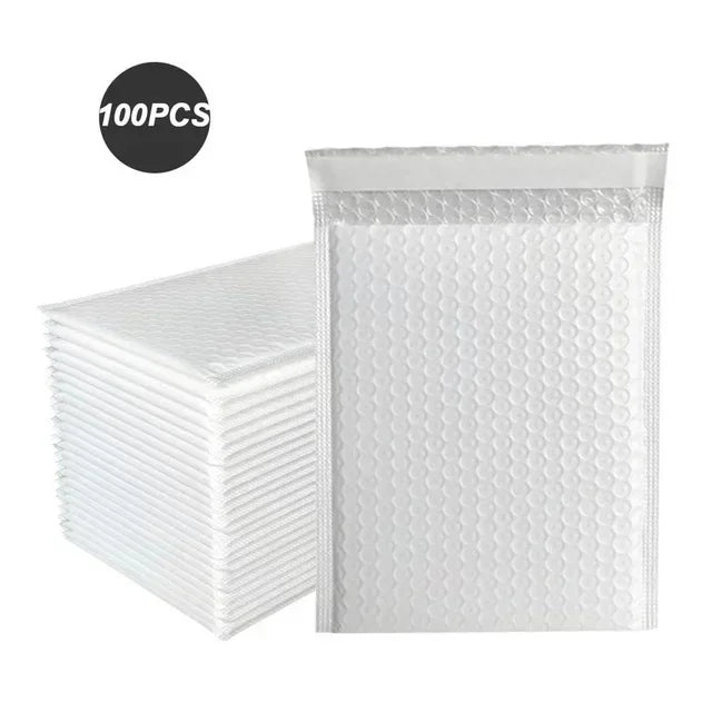 A stack of 100 clear bubble mailers in a white package for shipping.