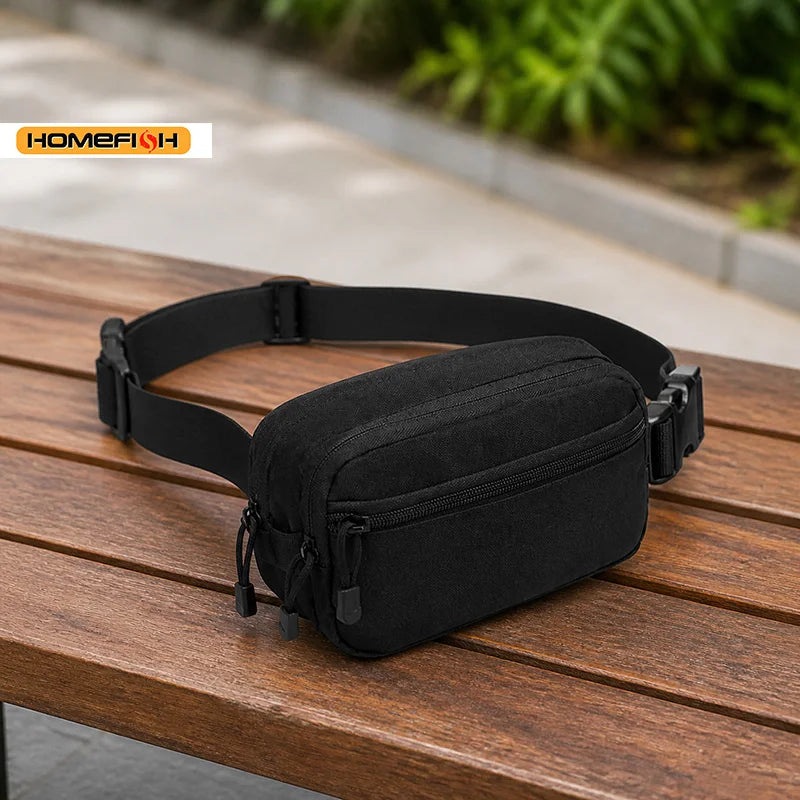 Black tactical MOLLE waist pack lying on a wooden surface.