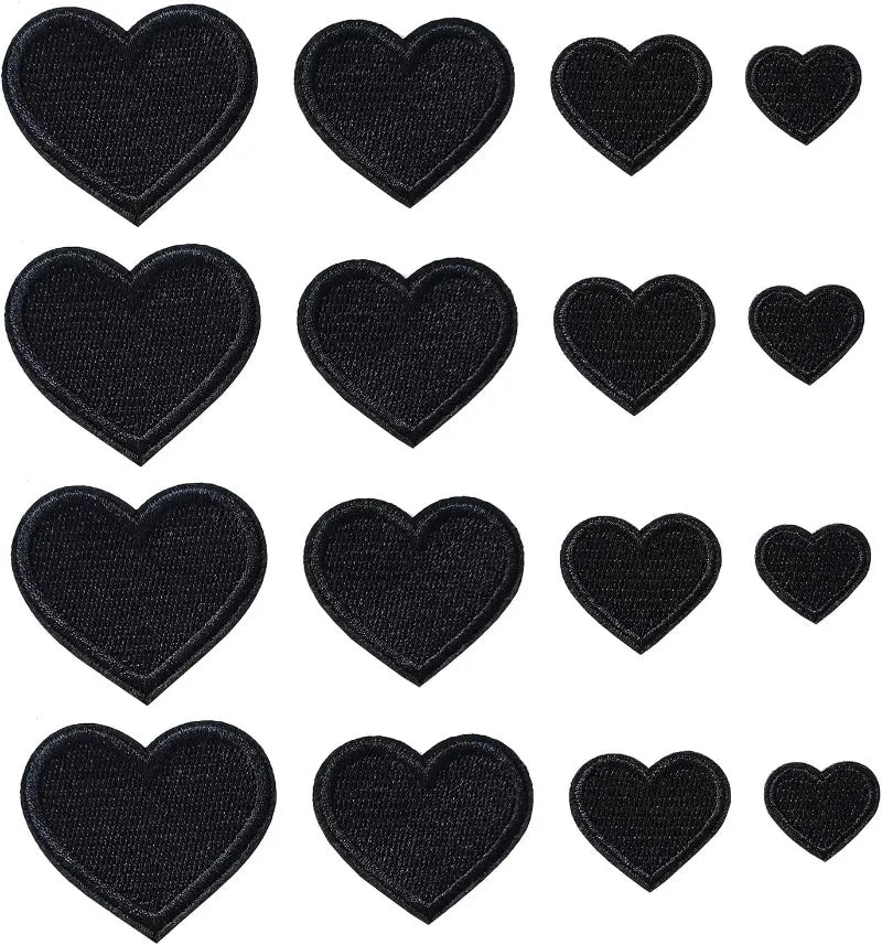 A collection of twenty-four black embroidered heart iron-on patches arranged in a grid.