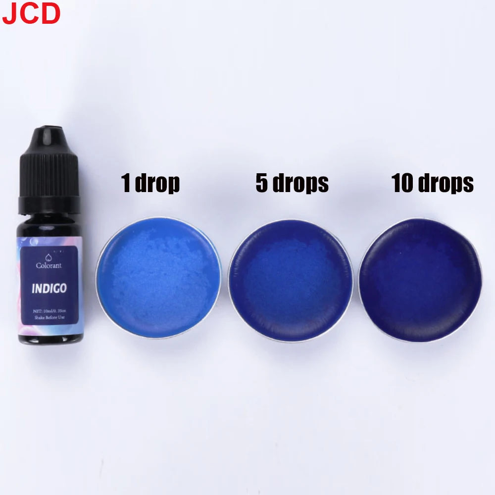 A set of indigo liquid candle dye drops in various quantities for DIY candle making