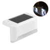 A white solar deck light with a dark panel and an inset showing illuminated LED step lights.