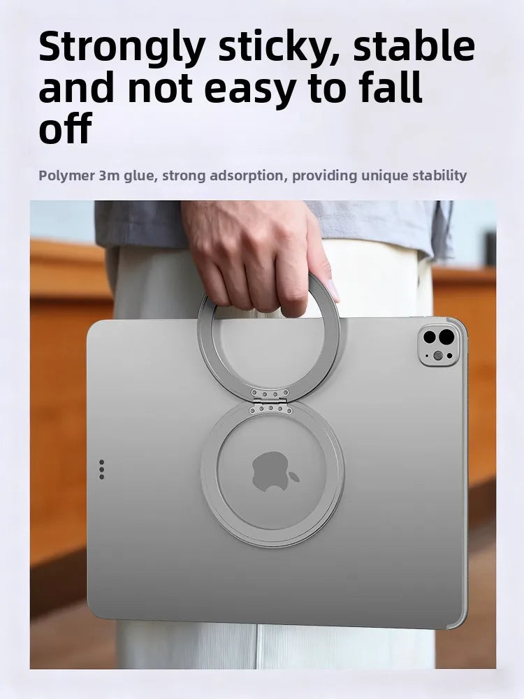 A gray Apple tablet is held in a magnetic holder with a strong adhesive base.