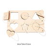 A wooden Montessori busy board featuring various shapes like squares, circles, triangles, and hearts for toddler learning.