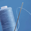 A close-up of a sewing needle and thread coming out of a blue spool or case.