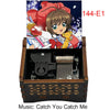 A wooden music box featuring a Cardcaptor Sakura theme, with an illustration of Sakura and a yellow creature on the lid.