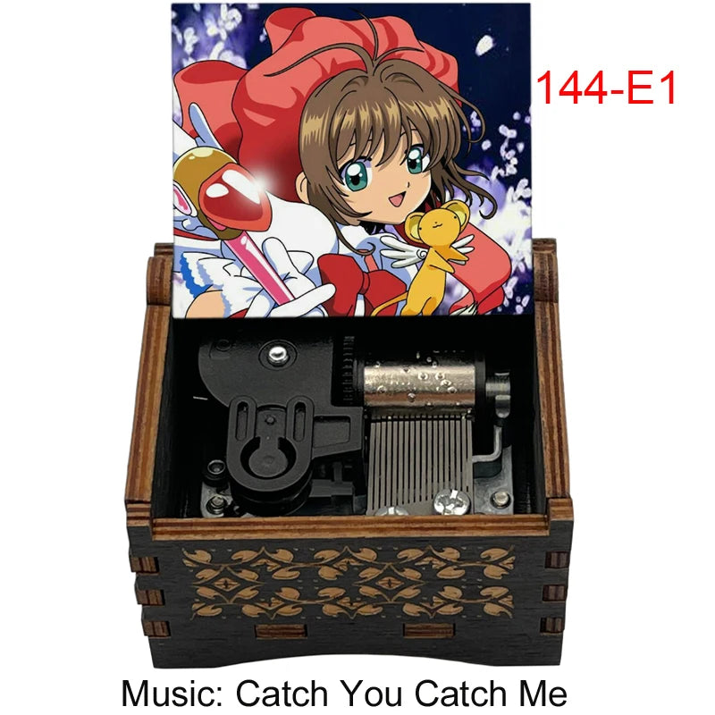 A wooden music box featuring a Cardcaptor Sakura theme, with an illustration of Sakura and a yellow creature on the lid.