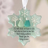 Handcrafted sea glass ornament shaped like a snowflake with frosted trees and a quote about relationships