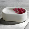 White silicone mold containing dried pink floral petals for resin or cement planters