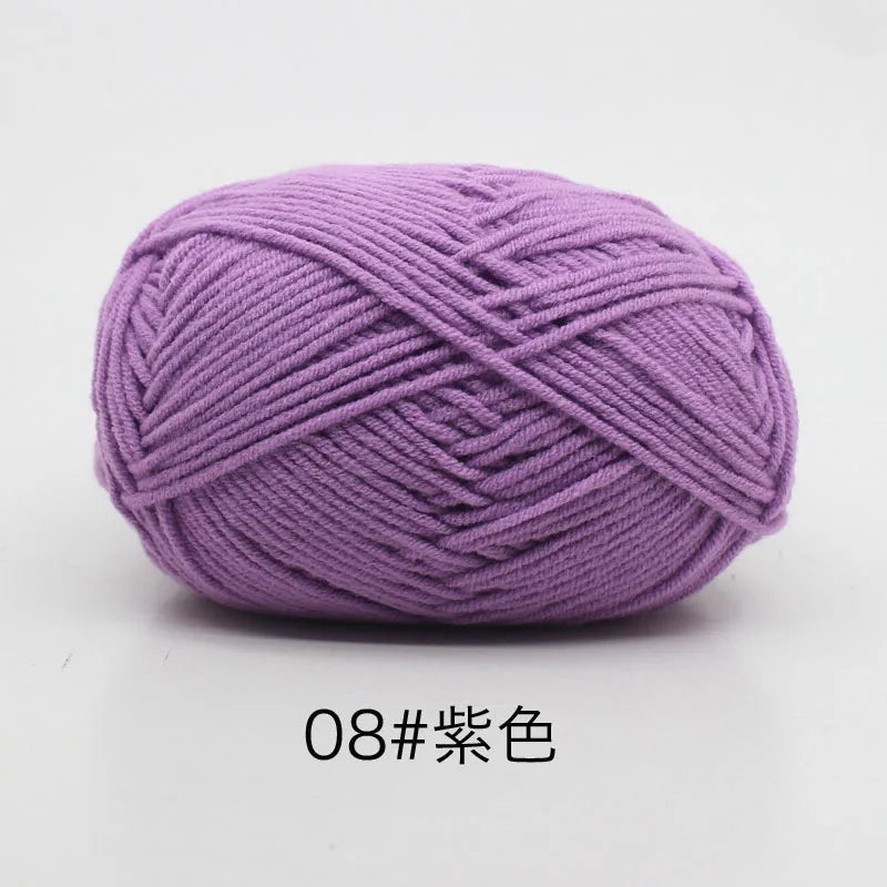 A ball of soft purple 4-ply milk cotton yarn for knitting and crochet.