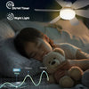 A child sleeping peacefully under a soft night light while a ceiling fan illuminates the room.
