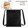 Black long line messenger bag with light beige interior shown alongside the exterior.