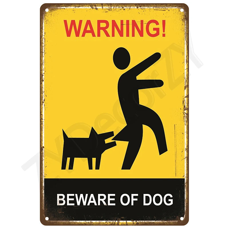A vintage metal tin sign with a yellow background and black text warning people to beware of dog.
