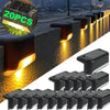 A collection of black solar-powered LED step lights arranged in a row.
